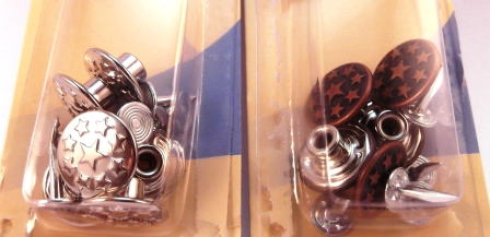 Two packets of jeans buttons. The packet on the left has nickel (silver) buttons and the packet on the right has red brass buttons.