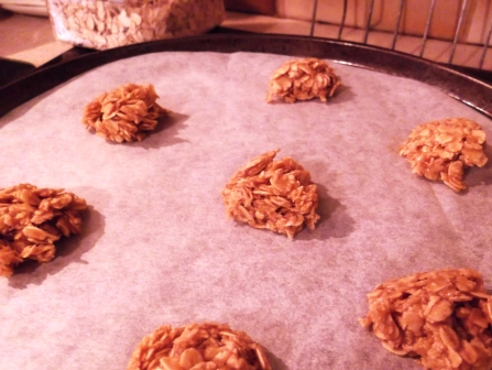 Uncooked Rolled Oat Biscuits on a baking tray.