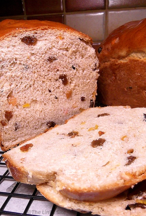 Close up of a fruit loaf that has had a couple of slices cut off one end.