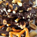 Stack of peanut and pretzel bark with a star shaped pretzel in front.