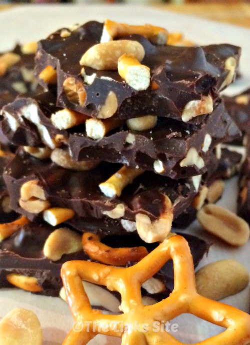 Stack of peanut and pretzel bark with a star shaped pretzel in front.