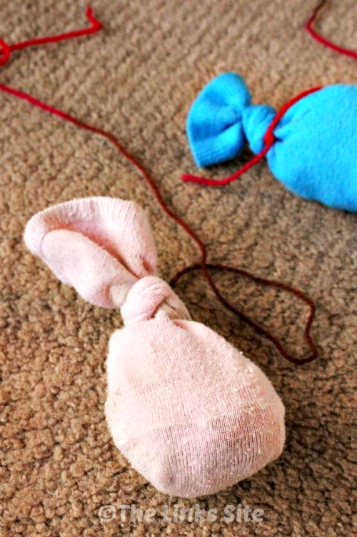 Use a pair of old socks to make a cute cat toy for your cat!