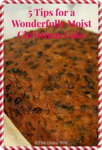 Cooked traditional fruit Christmas cake. Text overlay say: 5 Tips for a Wonderfully Moist Christmas Cake.