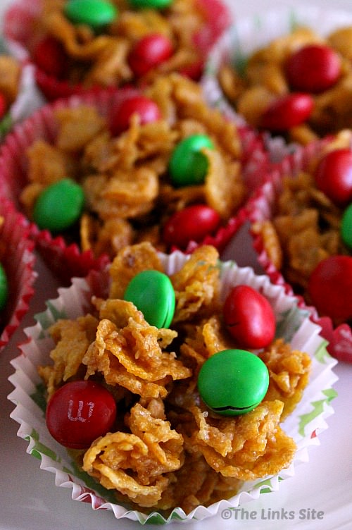 Several honey joys in paper cases topped with red and green M&M's.