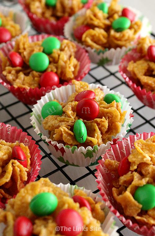 Honey Joys in Christmas themed paper cases on a wire cooling rack.