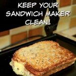 Toasted sandwich sitting on the plate of a sandwich press. Melted cheese is oozing out onto the hotplate. Text overlay says: One simple tip to keep your sandwich maker clean!
