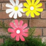Have a look at this tutorial to see how you can make flowers out of plastic bottles! thelinkssite.com