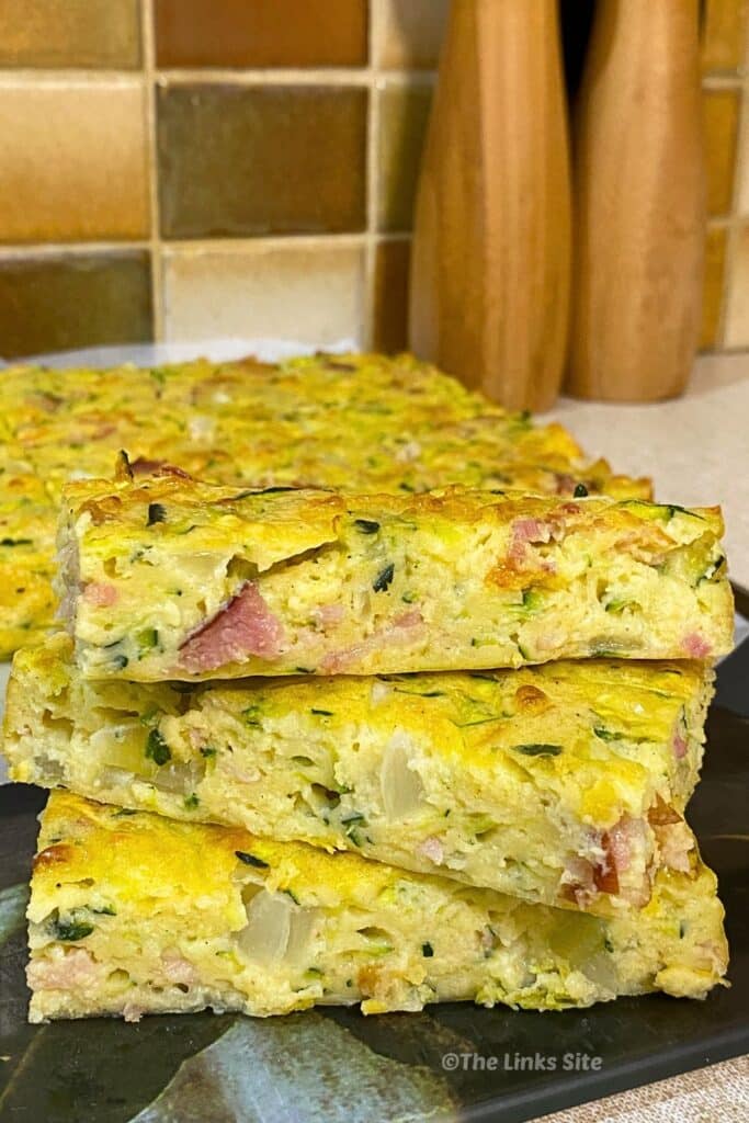 Three pieces of zucchini slice stacked one on top of the other.