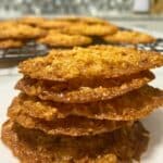 Stack of 5 biscuits with more seen in the background.