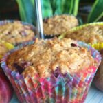 Plum Oat Muffins on a cake stand.